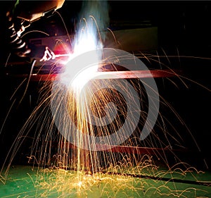 Worker welding metal