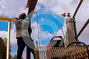 Welding process metal beams at construction site under works day