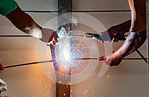 Worker welding steel bar.