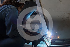 Worker welding the steel structure