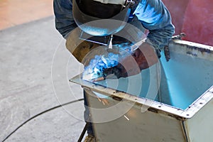 Worker welding the steel structure