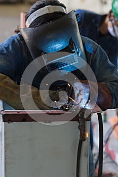 Worker welding the steel structure