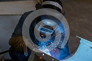 Worker welding the steel structure