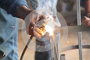 Worker welding the steel, version 1