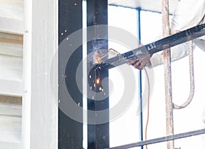 Worker welding structure at hight