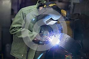 A worker in a welding suit