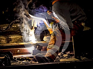 Worker welding train rail