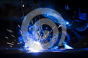 Worker welding using MIG/MAG. photo