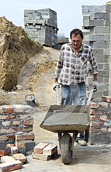 Worker with wheelbarrow