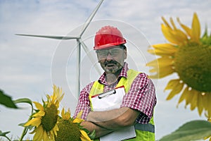 Worker by Wind Turbine in Rural Landscape