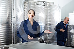 worker woman standing indoors on small wine manufacturing