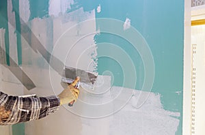 Worker work aligns with a spatula wall