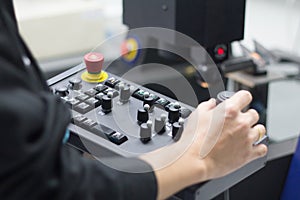 Worker working with coordinate measuring machine at workshop