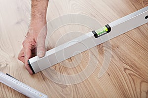 Worker working on laminate floor