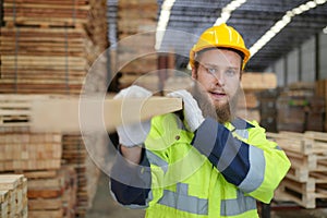 Worker are working at lumber yard in Large Warehouse.