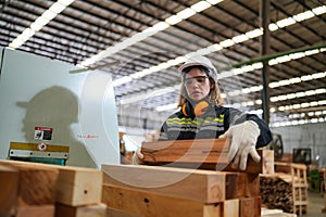 Worker are working at lumber yard in Large Warehouse.