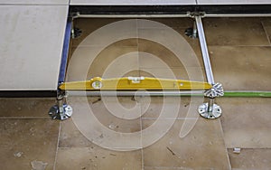 Worker working Raised floor in modern interior of server room in datacenter