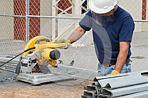 Worker Working with Saw