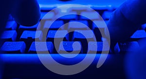 Worker working using PC computer. POV man typing on computer keyboard