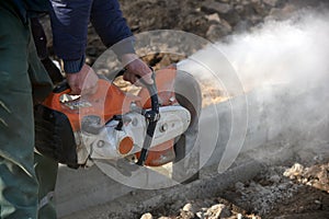 A worker works with a circular saw.