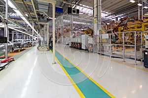 Workers assemble a vehicle body. process of welding cars. Modern Assembly of cars at the plant. automated build process