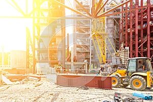 Workers Assemblers On The Excavator On The Construction Of An Industrial Facility