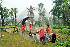 Workers are assembling lighting products in the park.