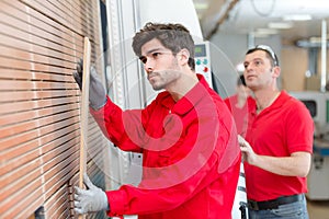 workers on blinds in factory