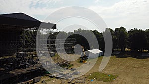 workers build a concert stage. Concept High-rise works. metal designs