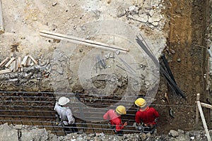 Workers at a building construction site