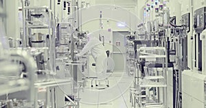 Workers in clean room in a semiconductors manufacturing facility