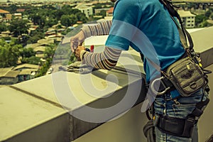 Workers cleaning windows service on high rise building
