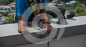 Workers cleaning windows service on high rise building