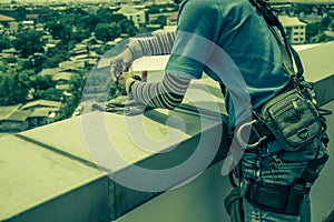 Workers cleaning windows service on high rise building