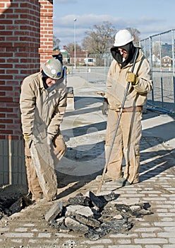 Workers Clearing Pavement