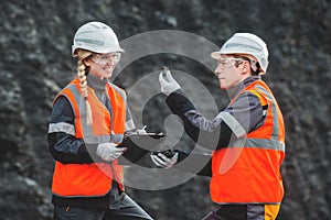 Workers with coal at open pit