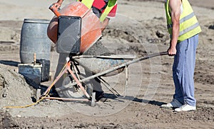 Workers with concrete mixer