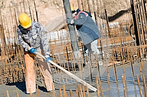 Workers on concrete works