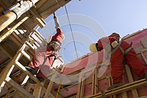 Workers Construct New Wall - Horizontal