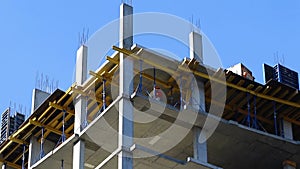 Workers on construction site, blue sky background video