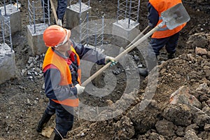 Workers at the construction site clearing debris