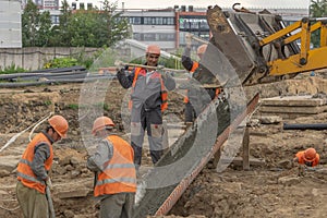 Workers at the construction site concrete foundation