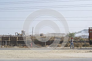 Workers at Construction with Trenching Ground in Background