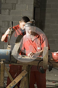 Workers Cut Rebar - Vertical