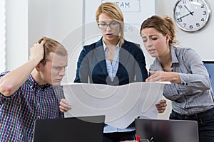 Workers discuss the project photo