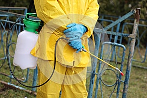 Workers disinfecting bus