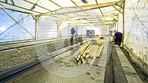 Workers do cleaning of the railway tram line after construction works.