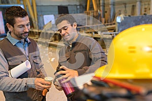 Workers drinking coffee at warehouse photo