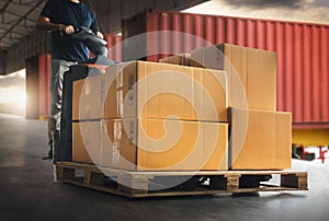 Workers Driving Forklift Pallet Jack Unloading Packaging Boxes. Cardboard Boxes. Supply Chain Shipping Warehouse. Shipment Boxes