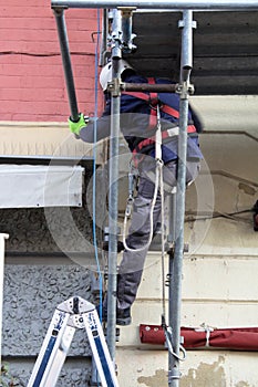 workers engaged in assembling a scaffolding photo